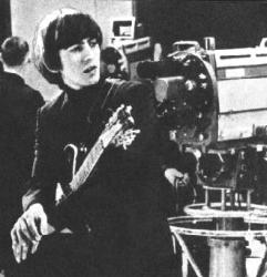 George playing guitar